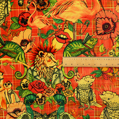 A busy, maximalist vintage-style fabric featuring a vibrant orange plaid background densely patterned with rock-and-roll animals in leather jackets and punk-inspired motifs, including cockatoos, flamingos, chameleons, a lion with a mohawk, meerkats, and lemurs intertwined with large flowers like poppies and pansies.
