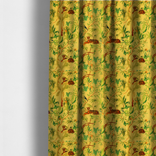 The fabric used to create these made-to-measure curtains is a vibrant yellow fabric featuring a dense tropical jungle pattern with tigers lounging on branches, toucans, herons, monkeys, and lush green foliage.   