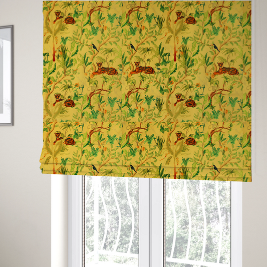 The fabric used to create these Roman blinds is a vibrant yellow fabric featuring a dense tropical jungle pattern with tigers lounging on branches, toucans, herons, monkeys, and lush green foliage.   