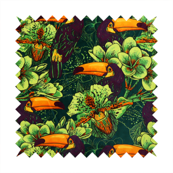 A dark green fabric densely patterned with toucans featuring large orange-and-yellow beaks, surrounded by glowing light green and orange tropical flowers.   