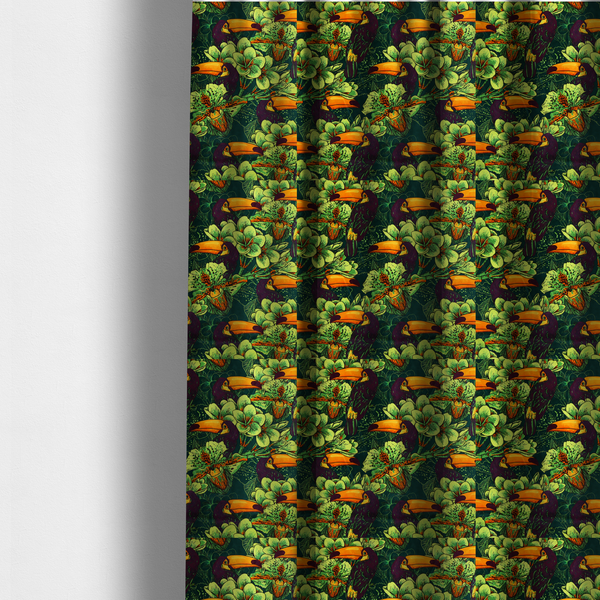 The fabric used to create these made-to-measure curtains is a dark green fabric densely patterned with toucans featuring large orange-and-yellow beaks, surrounded by glowing light green and orange tropical flowers.   