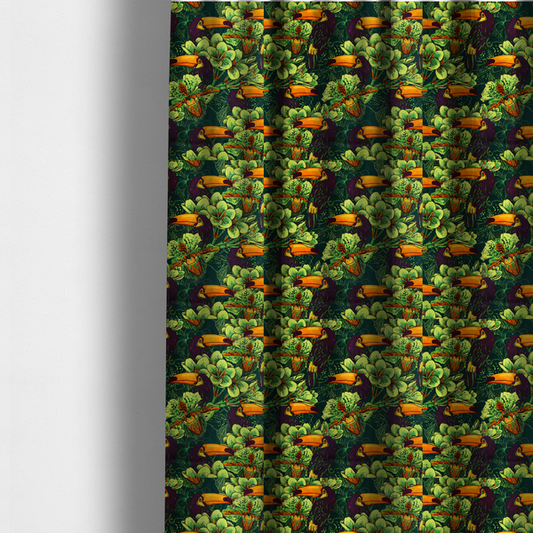 The fabric used to create these made-to-measure curtains is a dark green fabric densely patterned with toucans featuring large orange-and-yellow beaks, surrounded by glowing light green and orange tropical flowers.   