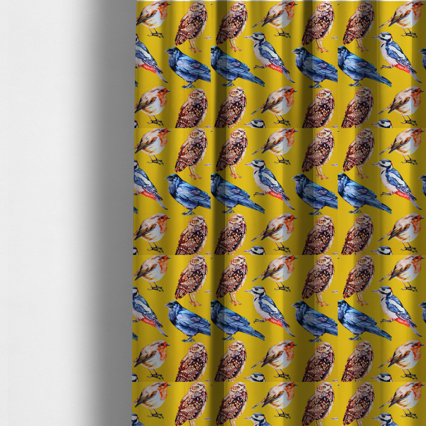 The fabric used to create these made-to-measure curtains is a vibrant yellow fabric patterned with a repeat design of various illustrated birds, including owls, robins, woodpeckers, and bluebirds