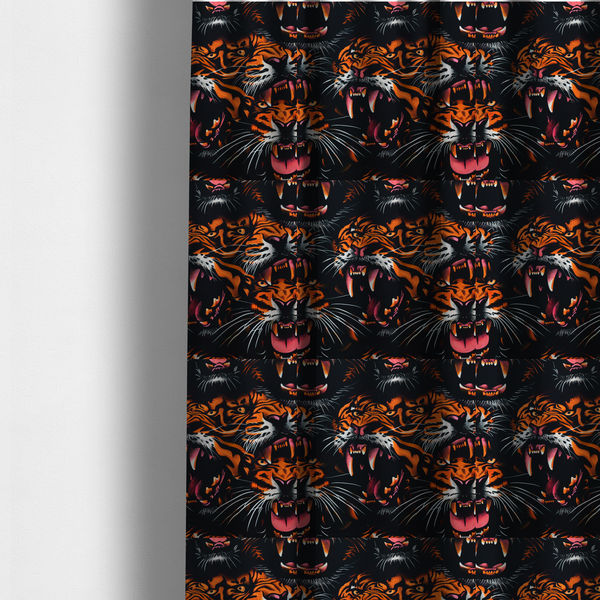 The fabric used to create these made-to-measure curtains is a dark patterned fabric featuring an aggressive, repeated motif of roaring tigers with bared fangs, detailed in vibrant orange, white, and pink against a black background.   