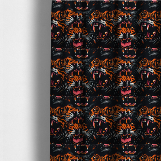 The fabric used to create these made-to-measure curtains is a dark patterned fabric featuring an aggressive, repeated motif of roaring tigers with bared fangs, detailed in vibrant orange, white, and pink against a black background.   