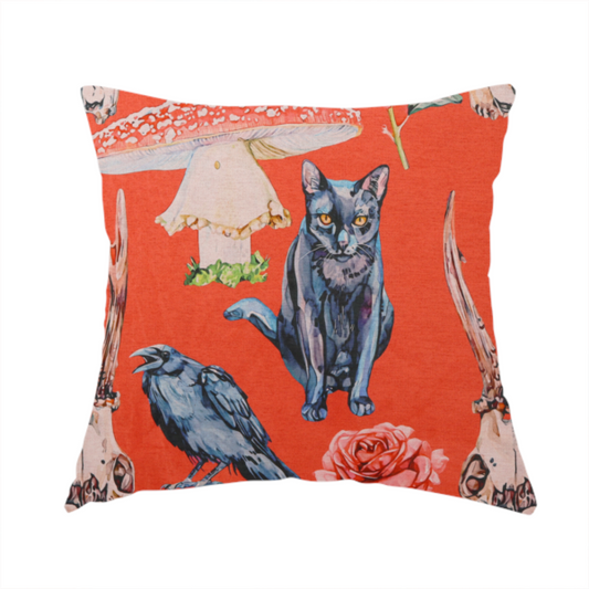 The fabric used to create this handmade cushion is a red fabric patterned with hand-drawn gothic illustrations of black cats, crows, animal skulls, mushrooms, and roses featuring an organic style.