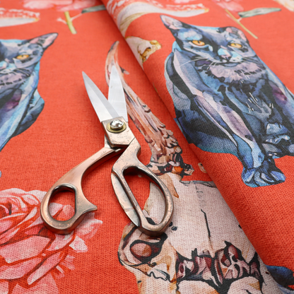 A red fabric patterned with hand-drawn gothic illustrations of black cats, crows, animal skulls, mushrooms, and roses featuring an organic style.