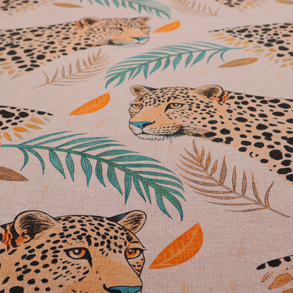 A pink fabric patterned with hand-drawn jungle illustrations of leopards and tropical leaves featuring an organic style.   