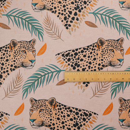 A pink fabric patterned with hand-drawn jungle illustrations of leopards and tropical leaves featuring an organic style.   