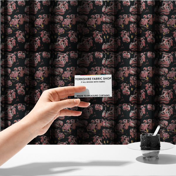 The fabric used to create these made-to-measure curtains is a dark grey fabric patterned with hand-drawn illustrations of hippos featuring an organic style.