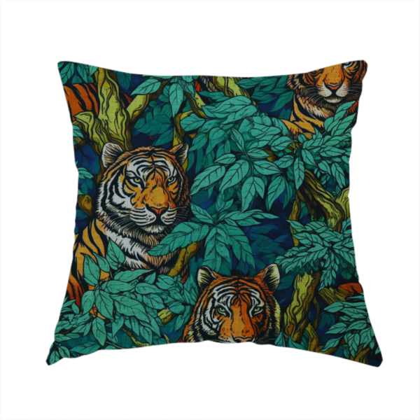 The fabric used to create this handmade cushion is a dark blue fabric patterned with hand-drawn jungle illustrations of tigers nestled among dense green leaves featuring an organic style.