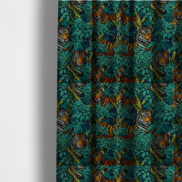 The fabric used to create these made-to-measure curtains is a dark blue fabric patterned with hand-drawn jungle illustrations of tigers nestled among dense green leaves featuring an organic style.