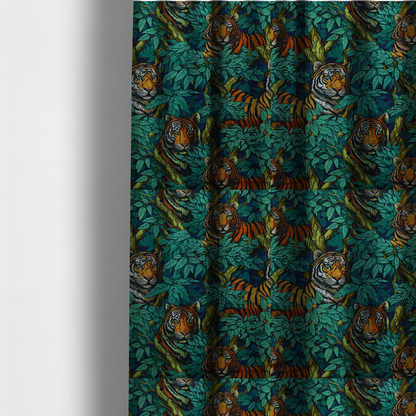 The fabric used to create these made-to-measure curtains is a dark blue fabric patterned with hand-drawn jungle illustrations of tigers nestled among dense green leaves featuring an organic style.