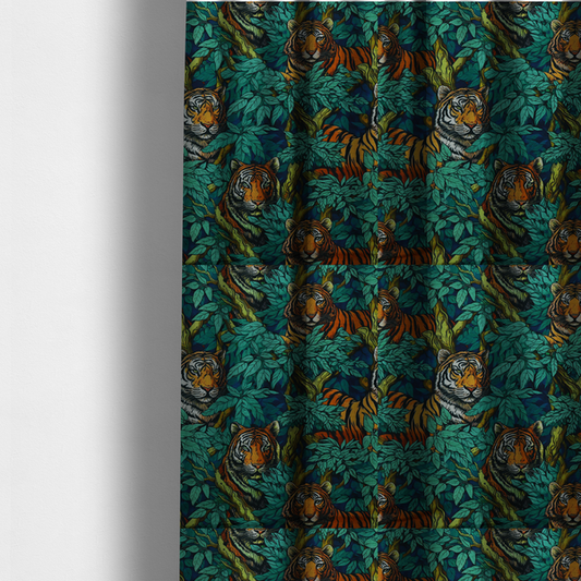 The fabric used to create these made-to-measure curtains is a dark blue fabric patterned with hand-drawn jungle illustrations of tigers nestled among dense green leaves featuring an organic style.