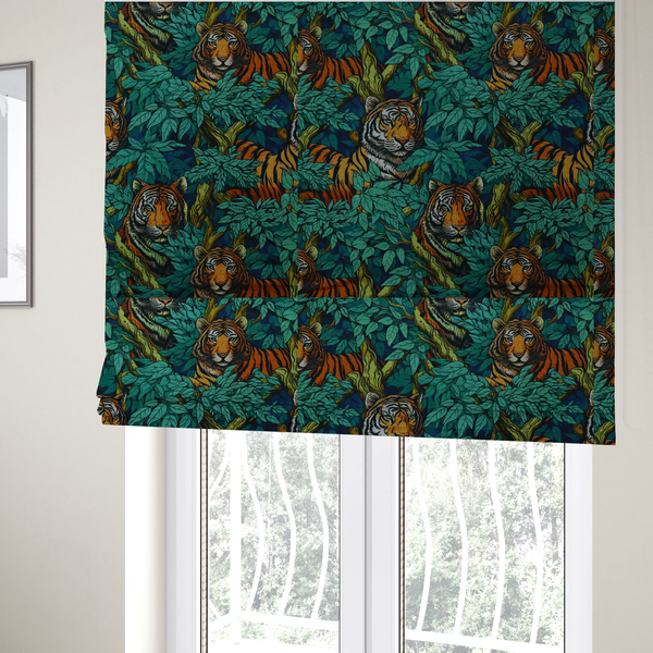 The fabric used to create these Roman blinds is a dark blue fabric patterned with hand-drawn jungle illustrations of tigers nestled among dense green leaves featuring an organic style.