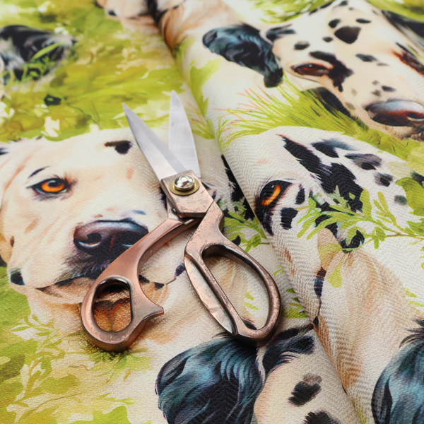 A green and white fabric patterned with hand-drawn illustrations of Dalmatians nestled among lush foliage featuring an organic style.