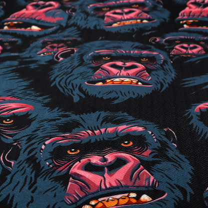A dark blue fabric patterned with hand-drawn illustrations of gorillas featuring an organic style.   