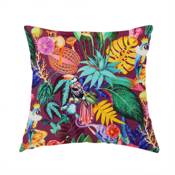 The fabric used to create this handmade cushion is a burgundy fabric patterned with hand-drawn jungle illustrations of toucans, tarsiers, colourful birds, and tropical foliage featuring an organic style.   
