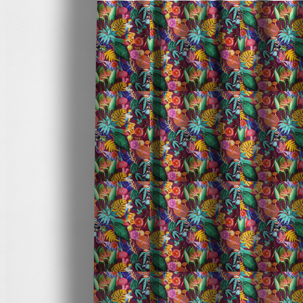 The fabric used to create these made-to-measure curtains is a burgundy fabric patterned with hand-drawn jungle illustrations of toucans, tarsiers, colourful birds, and tropical foliage featuring an organic style.   
