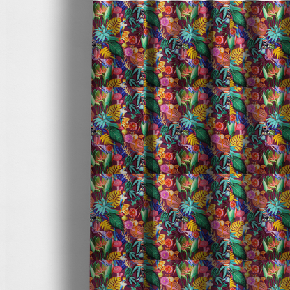 The fabric used to create these made-to-measure curtains is a burgundy fabric patterned with hand-drawn jungle illustrations of toucans, tarsiers, colourful birds, and tropical foliage featuring an organic style.   
