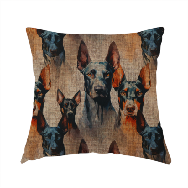 The fabric used to create this handmade cushion is a repeating fabric pattern featuring portraits of Doberman dogs with pointed ears against a textured, burlap-like brown background.