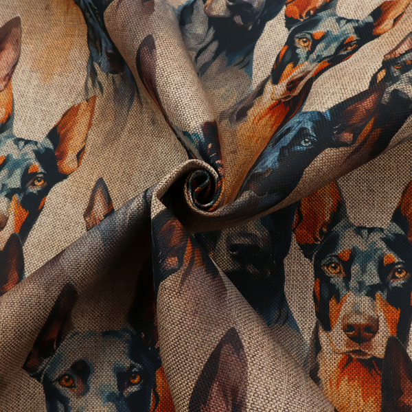 A repeating fabric pattern featuring portraits of Doberman dogs with pointed ears against a textured, burlap-like brown background.