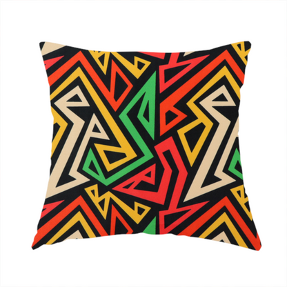The fabric used to create this handmade cushion is a repeating geometric fabric pattern on a black background featuring interlocking angular lines in red, yellow, green, and beige.