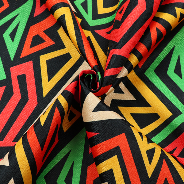 A repeating geometric fabric pattern on a black background featuring interlocking angular lines in red, yellow, green, and beige.