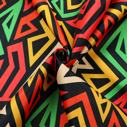 A repeating geometric fabric pattern on a black background featuring interlocking angular lines in red, yellow, green, and beige.
