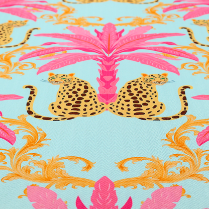 A vibrant fabric pattern featuring repeating pairs of leopards, bright pink palm trees, and gold baroque scrollwork against a light blue background.