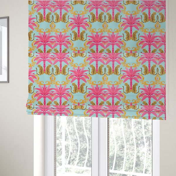 The fabric used to create these Roman blinds is a vibrant fabric pattern featuring repeating pairs of leopards, bright pink palm trees, and gold baroque scrollwork against a light blue background.