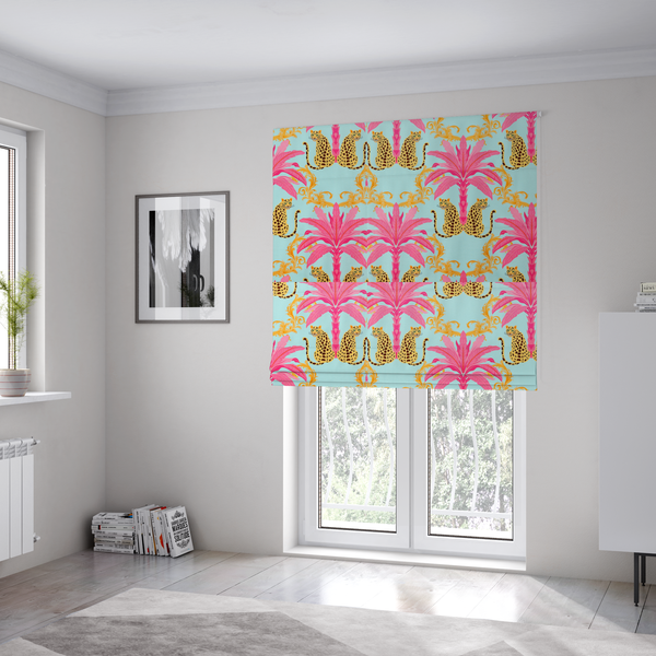 The fabric used to create these Roman blinds is a vibrant fabric pattern featuring repeating pairs of leopards, bright pink palm trees, and gold baroque scrollwork against a light blue background.