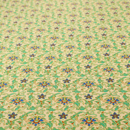 A dense, intricate fabric pattern featuring repeating blue and orange floral blossoms interwoven with teal scrollwork and leafy vines on a light gold background.