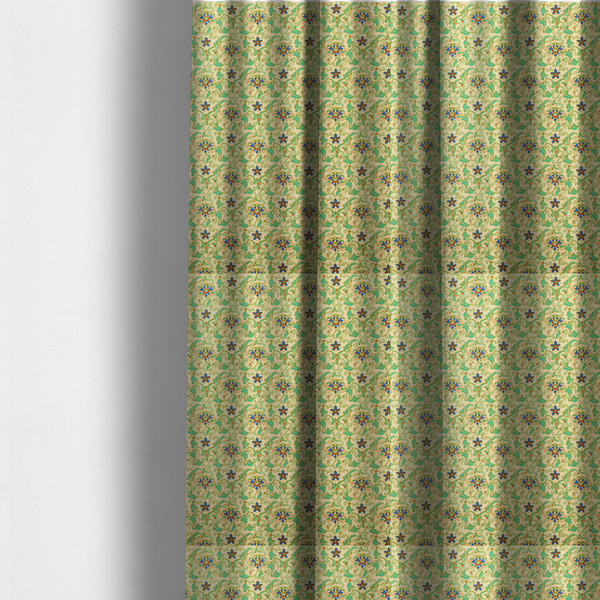 The fabric used to create these made-to-measure curtains is a dense, intricate fabric pattern featuring repeating blue and orange floral blossoms interwoven with teal scrollwork and leafy vines on a light gold background.