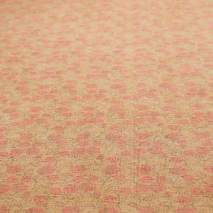 A beige fabric patterned with hand-drawn botanical illustrations of small pink flowers and vines featuring an organic style.