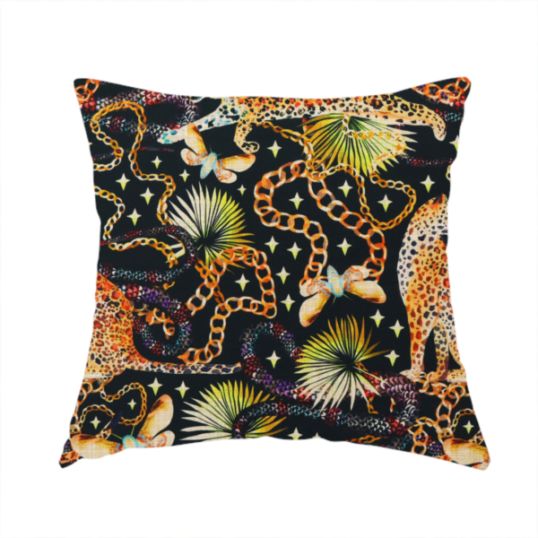 The fabric used to create this handmade cushion is a dark blue fabric patterned with hand-drawn jungle illustrations of leopards, golden chains, tropical leaves, and butterflies featuring an organic style.   