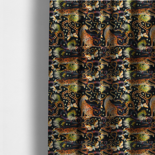 The fabric used to create these made-to-measure curtains is a dark blue fabric patterned with hand-drawn jungle illustrations of leopards, golden chains, tropical leaves, and butterflies featuring an organic style.   