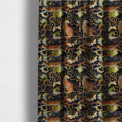 The fabric used to create these made-to-measure curtains is a dark blue fabric patterned with hand-drawn jungle illustrations of leopards, golden chains, tropical leaves, and butterflies featuring an organic style.   