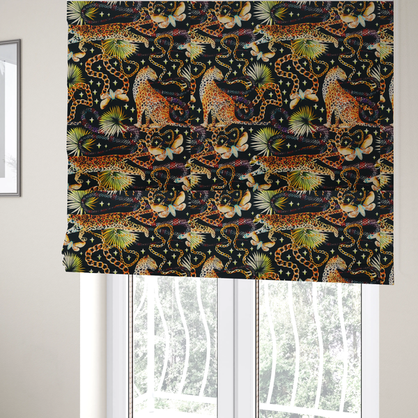 The fabric used to create these Roman blinds is a dark blue fabric patterned with hand-drawn jungle illustrations of leopards, golden chains, tropical leaves, and butterflies featuring an organic style.   