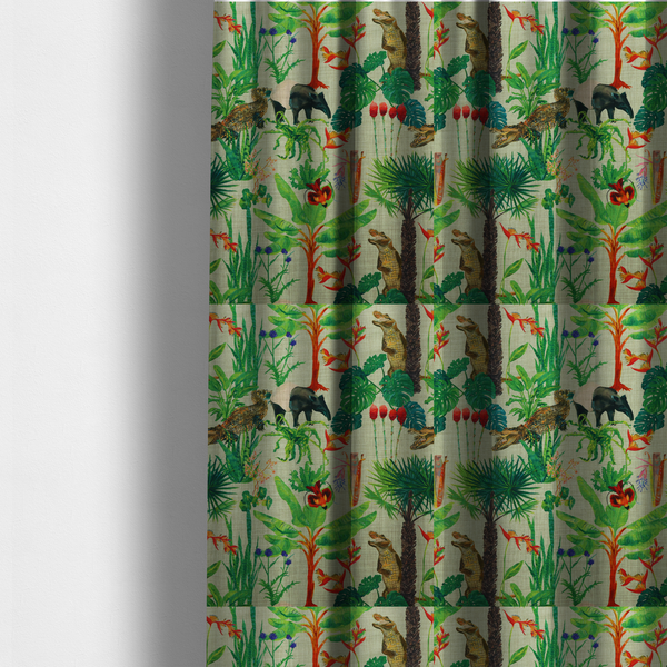 The fabric used to create these made-to-measure curtains is a green and beige fabric patterned with hand-drawn jungle illustrations of alligators, a tapir, tropical trees, and vibrant flowers featuring an organic style.
