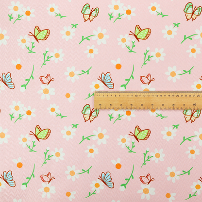 Pink fabric featuring a charming spring pattern with white daisies, green stems, and colourful butterflies in blue, green, and orange scattered across the surface.   
