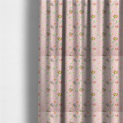 The fabric used to create these made-to-measure curtains is a pink fabric featuring a charming spring pattern with white daisies, green stems, and colourful butterflies in blue, green, and orange scattered across the surface.   
