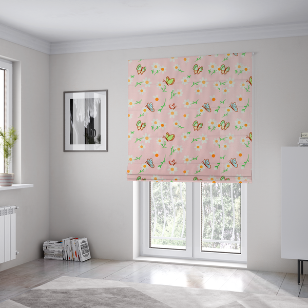 The fabric used to create these Roman blinds is a pink fabric featuring a charming spring pattern with white daisies, green stems, and colourful butterflies in blue, green, and orange scattered across the surface.   
