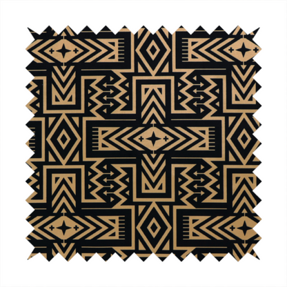 Black and gold geometric fabric featuring an intricate Navajo-inspired tribal pattern with chevron lines, diamonds, and cross motifs.