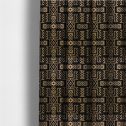 The fabric used to create these made-to-measure curtains is a black and gold geometric fabric featuring an intricate Navajo-inspired tribal pattern with chevron lines, diamonds, and cross motifs.