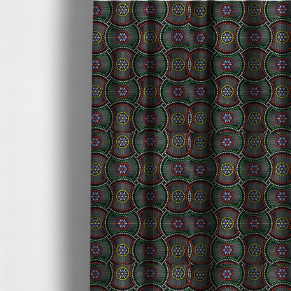 The fabric used to create these made-to-measure curtains is a vibrant multi-coloured fabric featuring a detailed dotted pattern with concentric circular motifs, floral-like centre rosettes, and striped geometric panels in black, red, green, blue, and yellow.   
