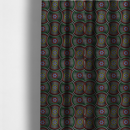 The fabric used to create these made-to-measure curtains is a vibrant multi-coloured fabric featuring a detailed dotted pattern with concentric circular motifs, floral-like centre rosettes, and striped geometric panels in black, red, green, blue, and yellow.   