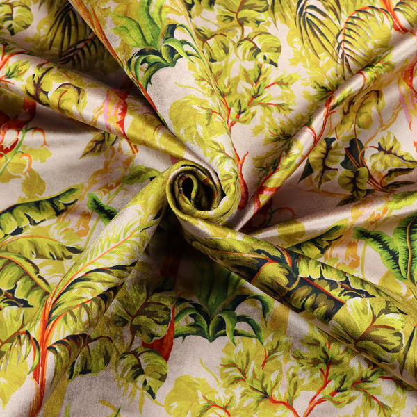 Lush tropical jungle fabric featuring a vibrant botanical pattern with palm trees, banana leaves, and exotic foliage in shades of green, yellow, and red.   