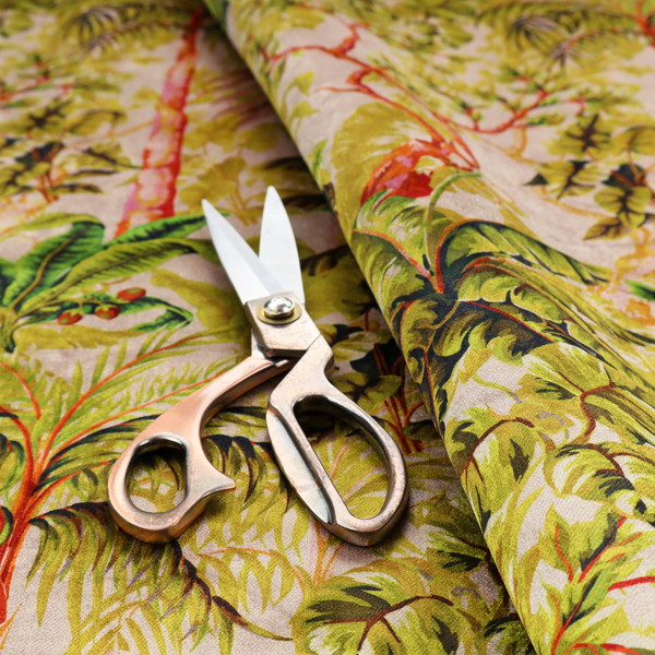 Lush tropical jungle fabric featuring a vibrant botanical pattern with palm trees, banana leaves, and exotic foliage in shades of green, yellow, and red.   