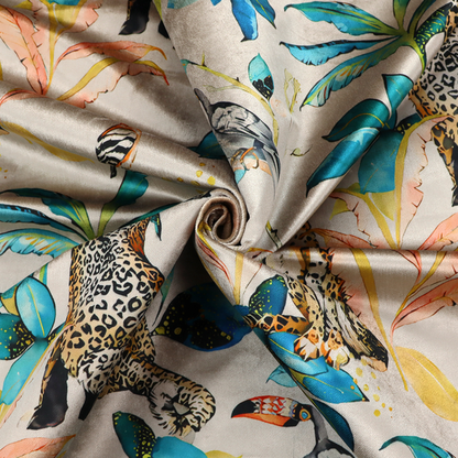 Exotic cream, blue, and orange fabric featuring a tropical jungle pattern with leopards, cheetahs, toucans, exotic birds, and lush foliage.   
